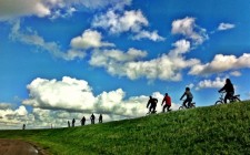 Exploring the historic towns north of Amsterdam cycling-on-dike-dyke-holland-photo