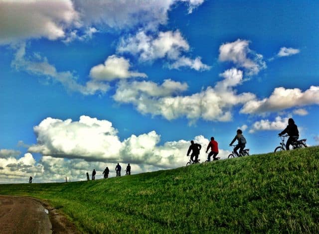 cycling-on-dike-dyke-holland cycling-on-dike-dyke-holland-photo