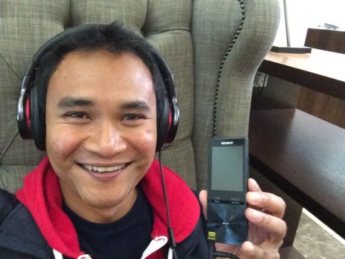 Waiting for my flight, accompanied by my Sony headphones and Walkman.