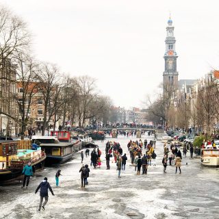 ice-skating-frozen-canal-amsterdam-photo