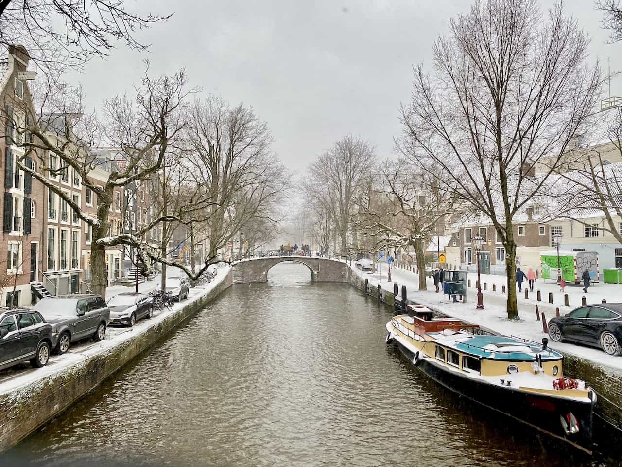 Snow and frozen canals in Amsterdam Winter 2021 Velvet Escape